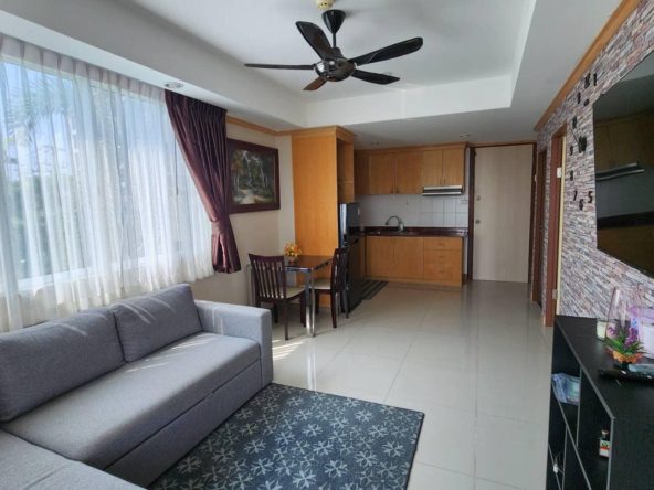 Modern condo in Khao Ta Lo, Pattaya, with rooftop pool and gym facilities.