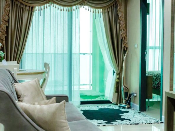 “Sea view living room in 2-bedroom Dusit Grand Condo View condo for sale Jomtien”