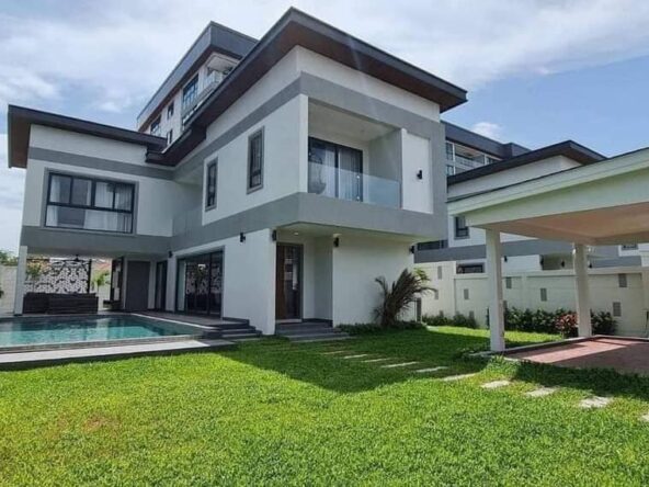 Luxurious Jomtien Pool Villa with spacious interiors, modern European kitchen, and a private swimming pool in a serene setting.