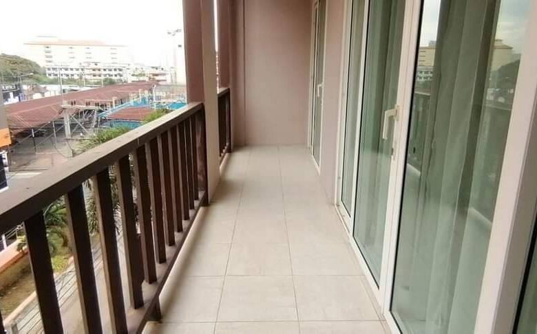 Luxurious 4-story Narai Place townhome in Pratumnak Soi 5 with modern exterior and lush surroundings.