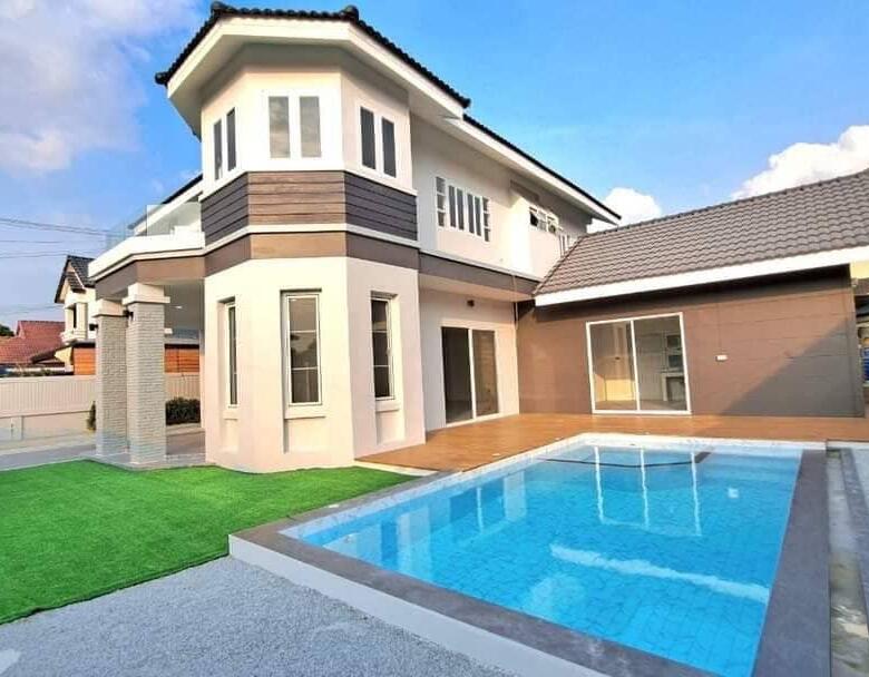 Exterior view of the luxurious pool villa in North Pattaya, showcasing modern architecture and lush landscaping.
