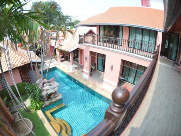Stunning view of a 10-bedroom luxury villa in Pratumnak Hill with a private pool and lush gardens.