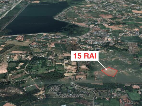Aerial view of prime land near Mabprachan Reservoir in Pattaya, showcasing its vast potential for development and close proximity to natural and urban amenities.