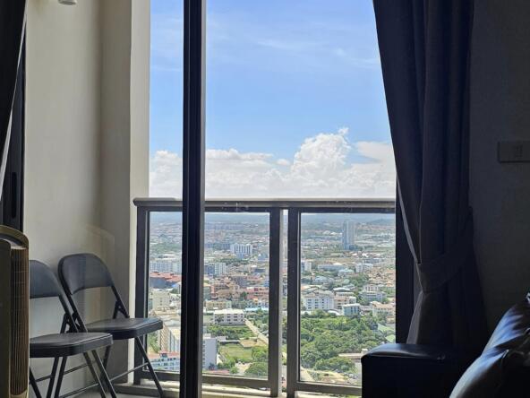 Modern 1-bedroom condo on the 34th floor at Unixx Condo Pattaya, with panoramic city views.