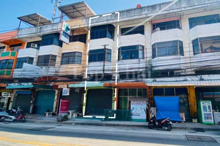 Modern 3-storey commercial building in Pattaya with vibrant storefronts.