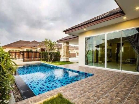 Aerial view of luxurious Huay Yai pool villa surrounded by lush gardens