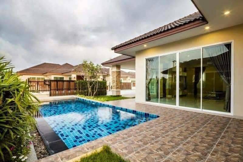 Aerial view of luxurious Huay Yai pool villa surrounded by lush gardens