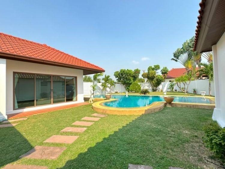 Luxurious Baan Balina 3 Pool Villa in Pattaya with lush gardens.