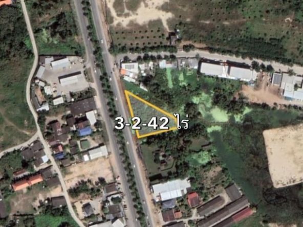 Aerial view of land for sale next to Sukhumvit Road in Na Jomtien, showcasing potential development opportunities.