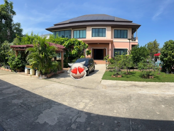 Exterior of a luxury house near The Mall Bang Khae with spacious grounds and elegant architecture.