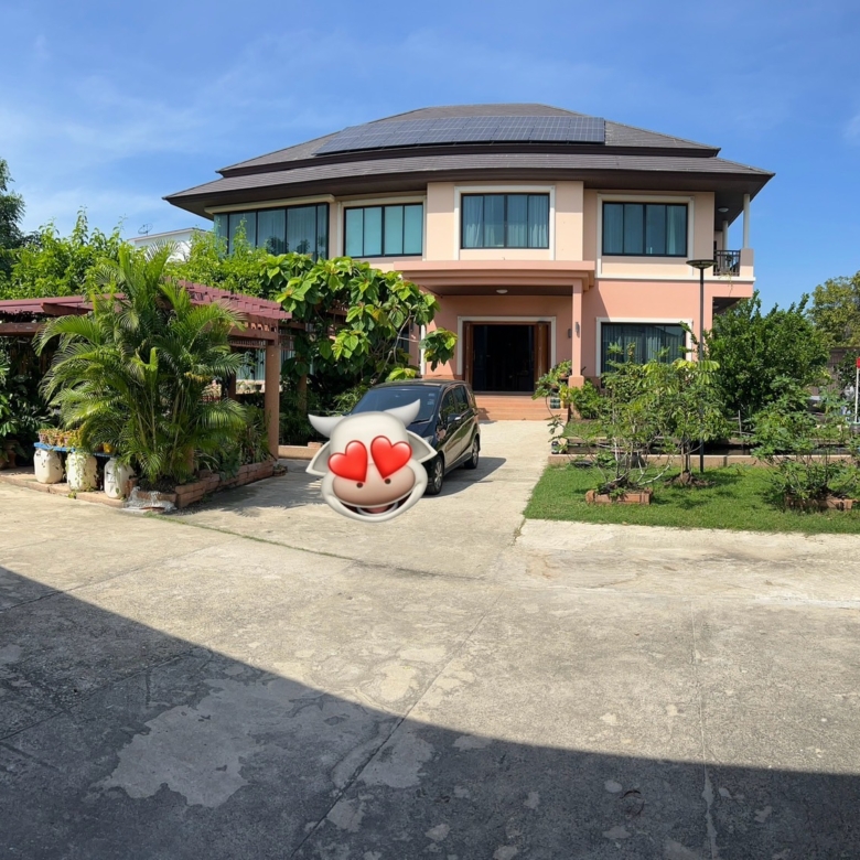 Exterior of a luxury house near The Mall Bang Khae with spacious grounds and elegant architecture.