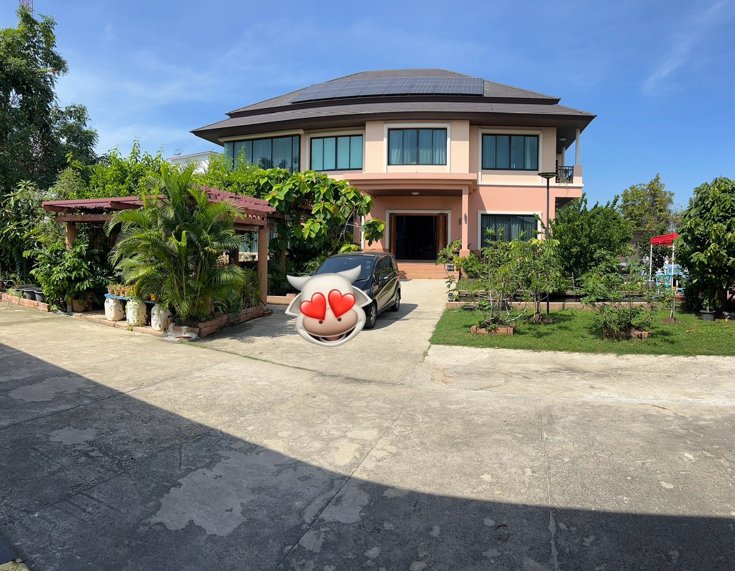 Exterior of a luxury house near The Mall Bang Khae with spacious grounds and elegant architecture.