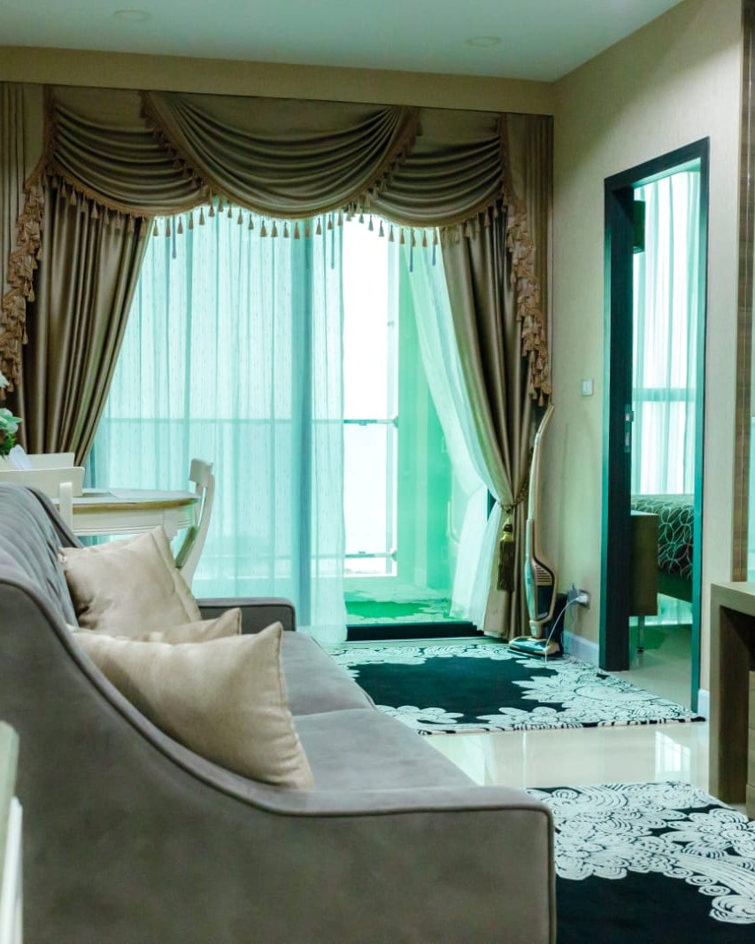 “Sea view living room in 2-bedroom Dusit Grand Condo View condo for sale Jomtien”
