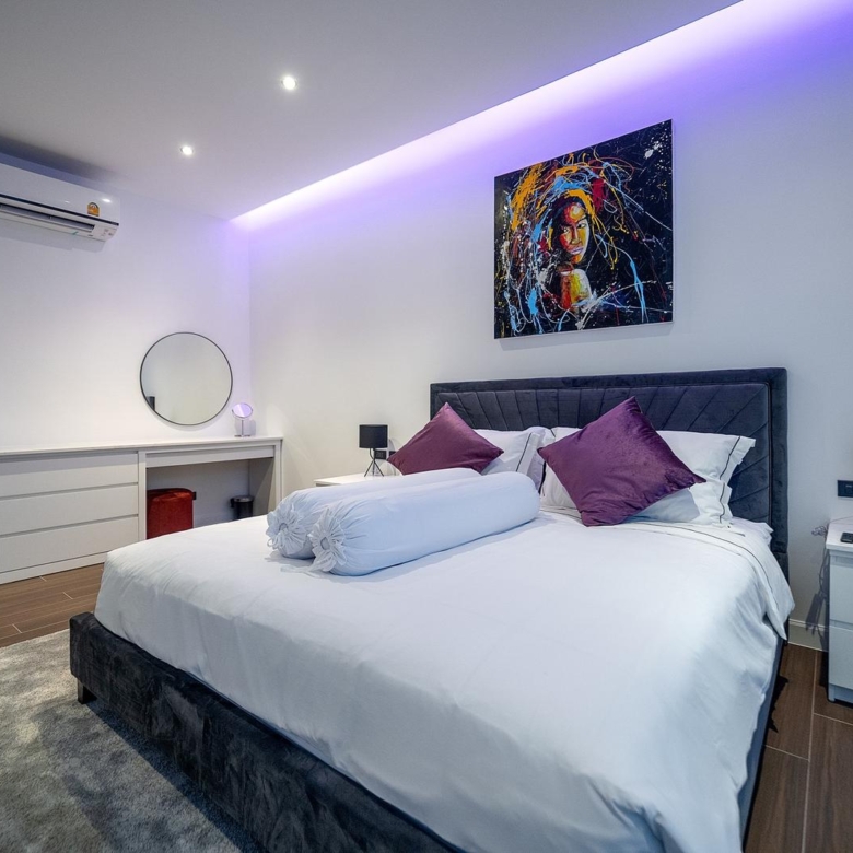 Spacious fully furnished living room with modern decor and open-plan layout in Pattaya luxury villa