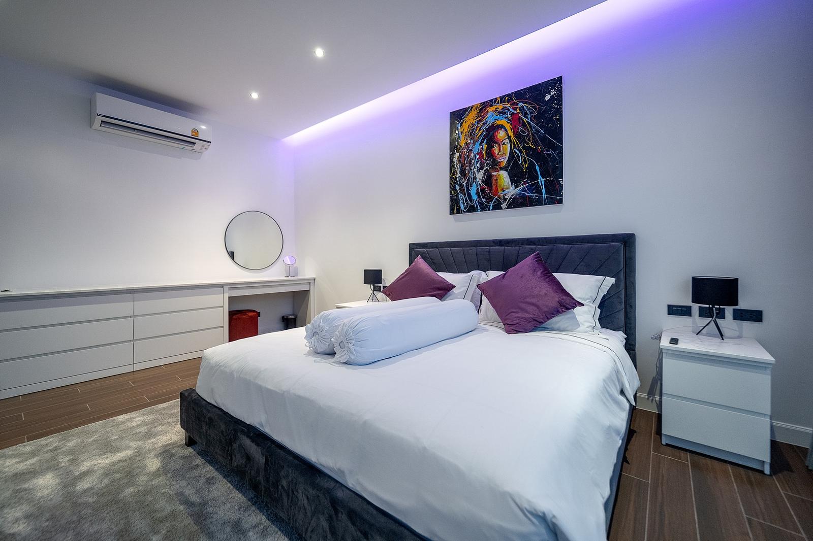 Spacious fully furnished living room with modern decor and open-plan layout in Pattaya luxury villa