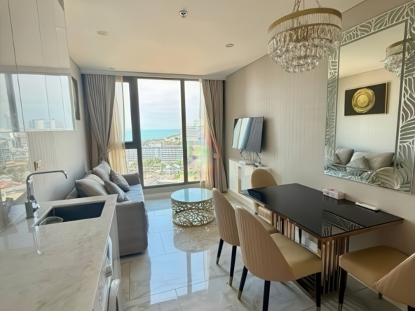Fully furnished living room with balcony facing Jomtien Bay – Copacabana condo