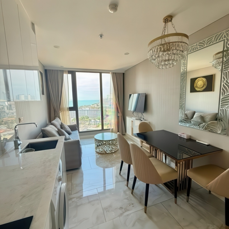Fully furnished living room with balcony facing Jomtien Bay – Copacabana condo