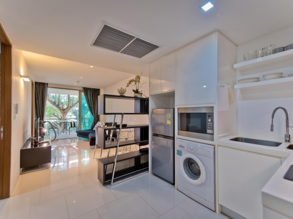Wongamat Condo in Pattaya modern apartment with balcony, bright bedroom, western kitchen, stylish bathroom and garden view near the beach