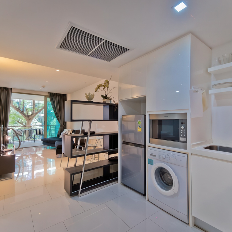 Wongamat Condo in Pattaya modern apartment with balcony, bright bedroom, western kitchen, stylish bathroom and garden view near the beach