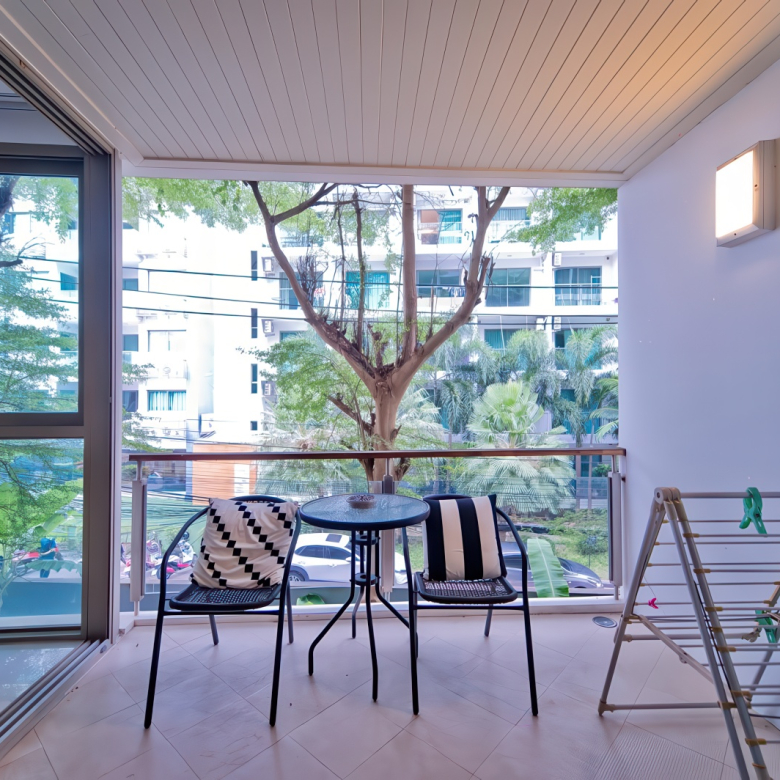Wongamat Condo in Pattaya modern apartment with balcony, bright bedroom, western kitchen, stylish bathroom and garden view near the beach