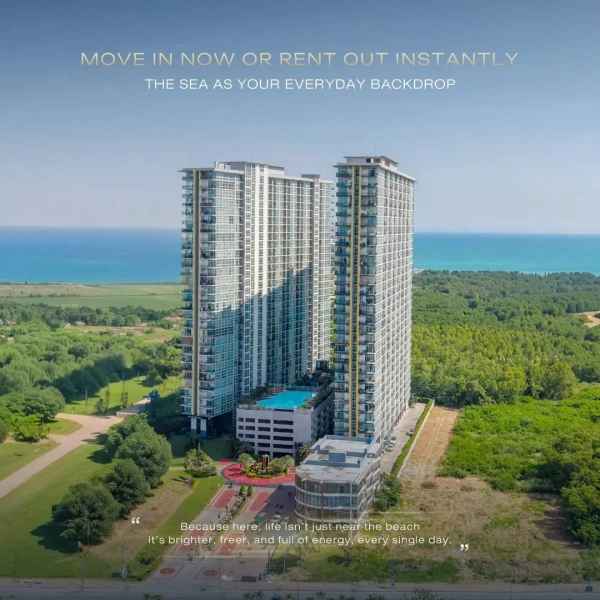 The Twins Tower Pattaya beachfront condominium aerial view with sea view, modern high-rise twin buildings and resort-style swimming pool in Thailand